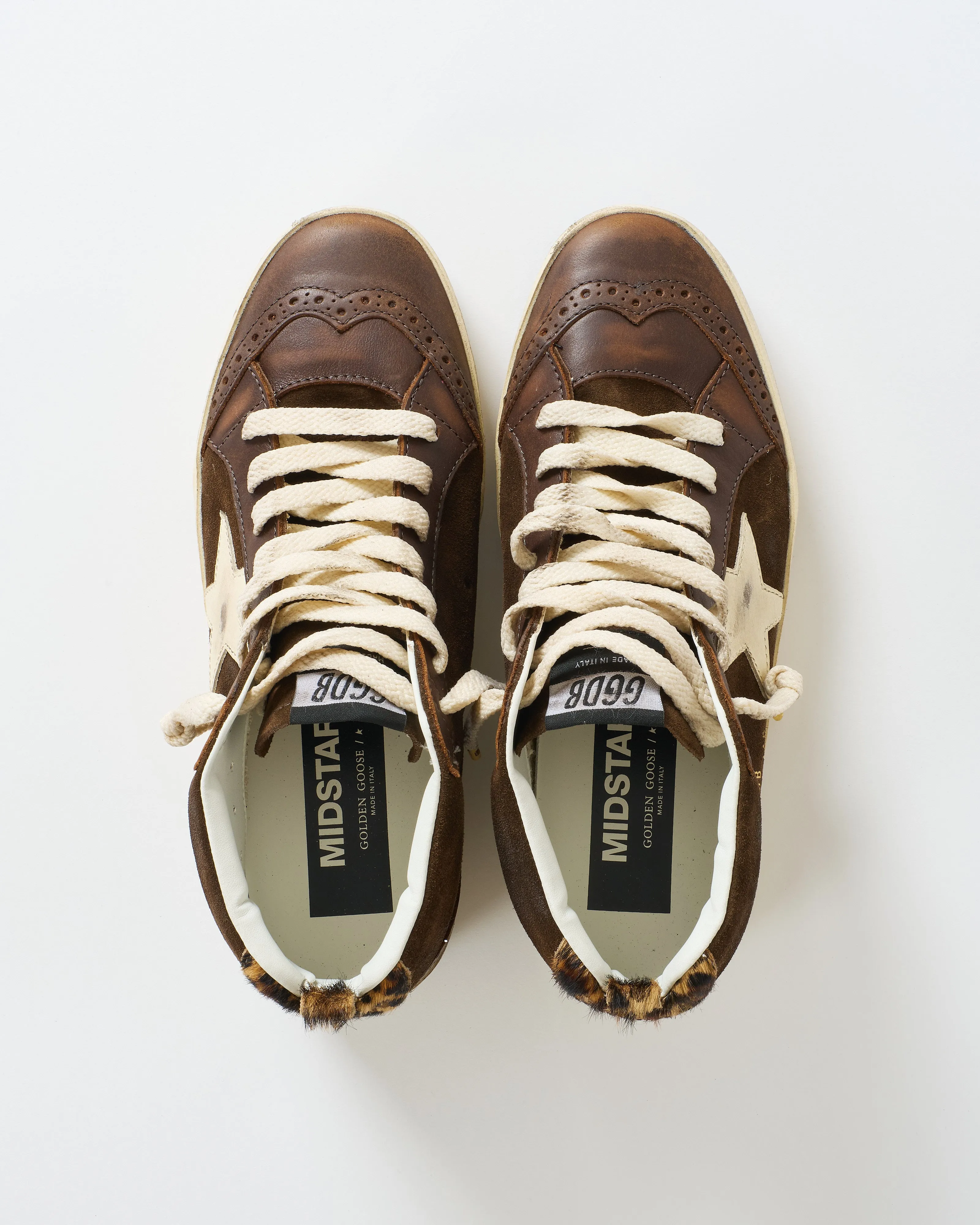 mid star leather toe spur and star suede upper horsy heel