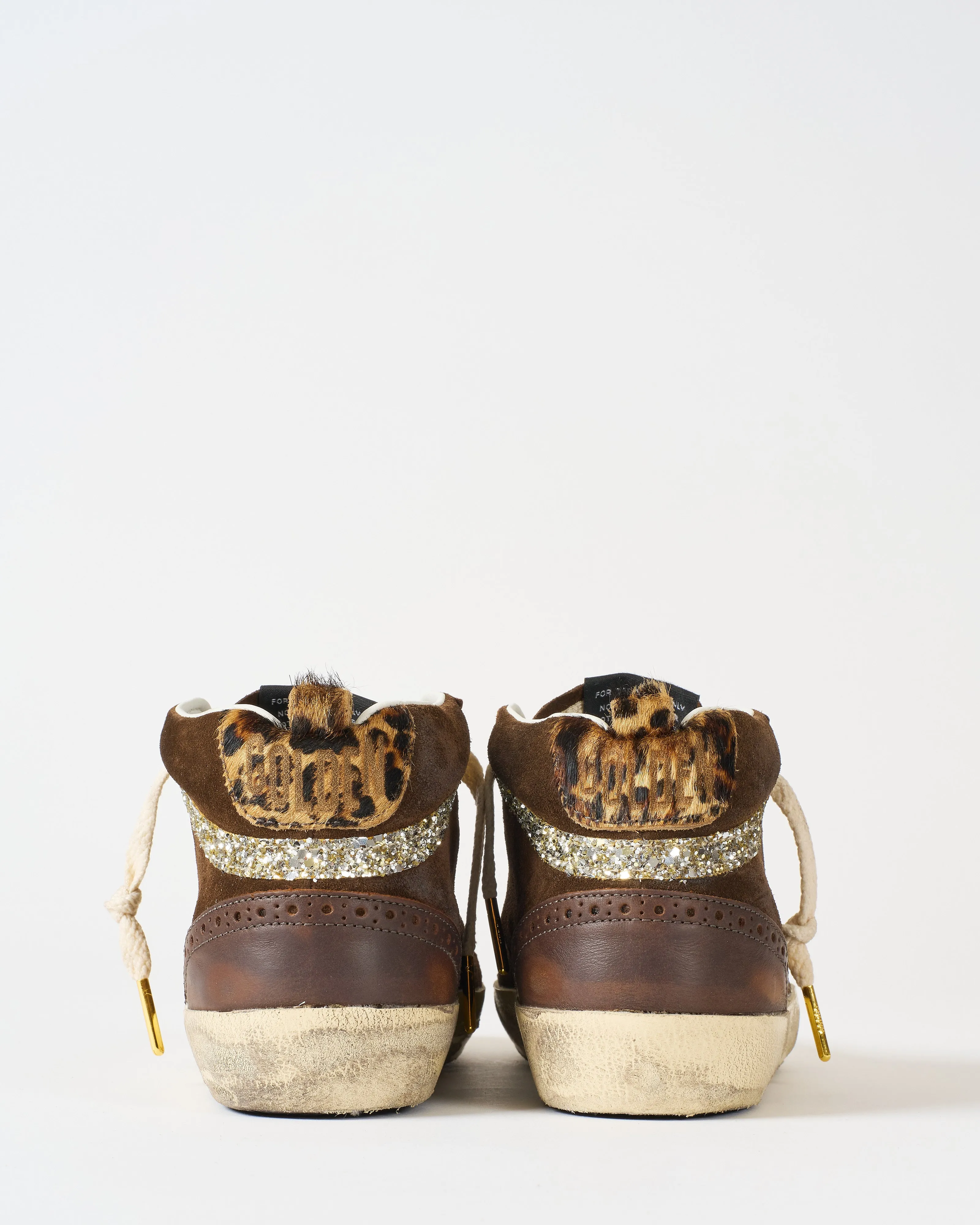 mid star leather toe spur and star suede upper horsy heel