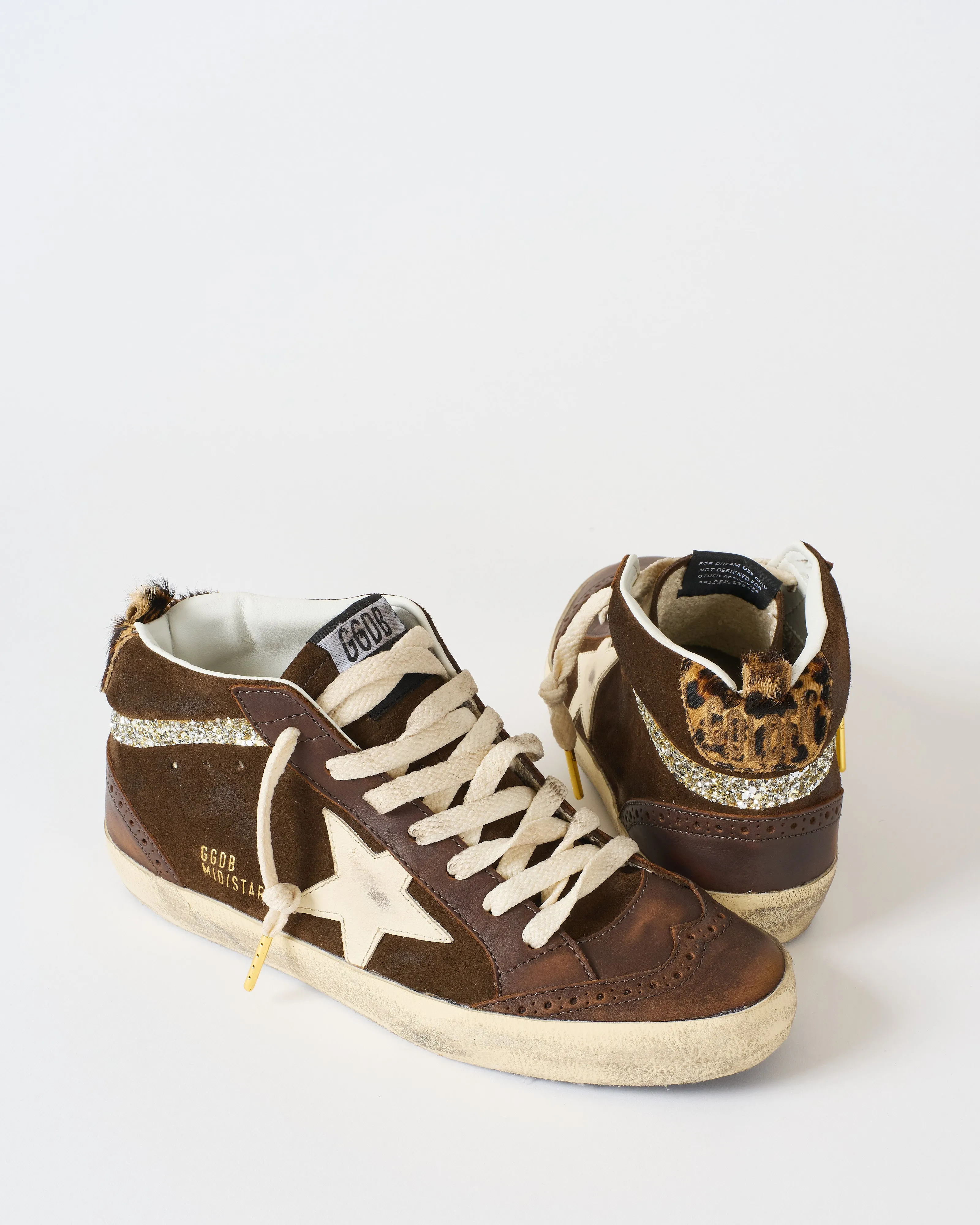 mid star leather toe spur and star suede upper horsy heel