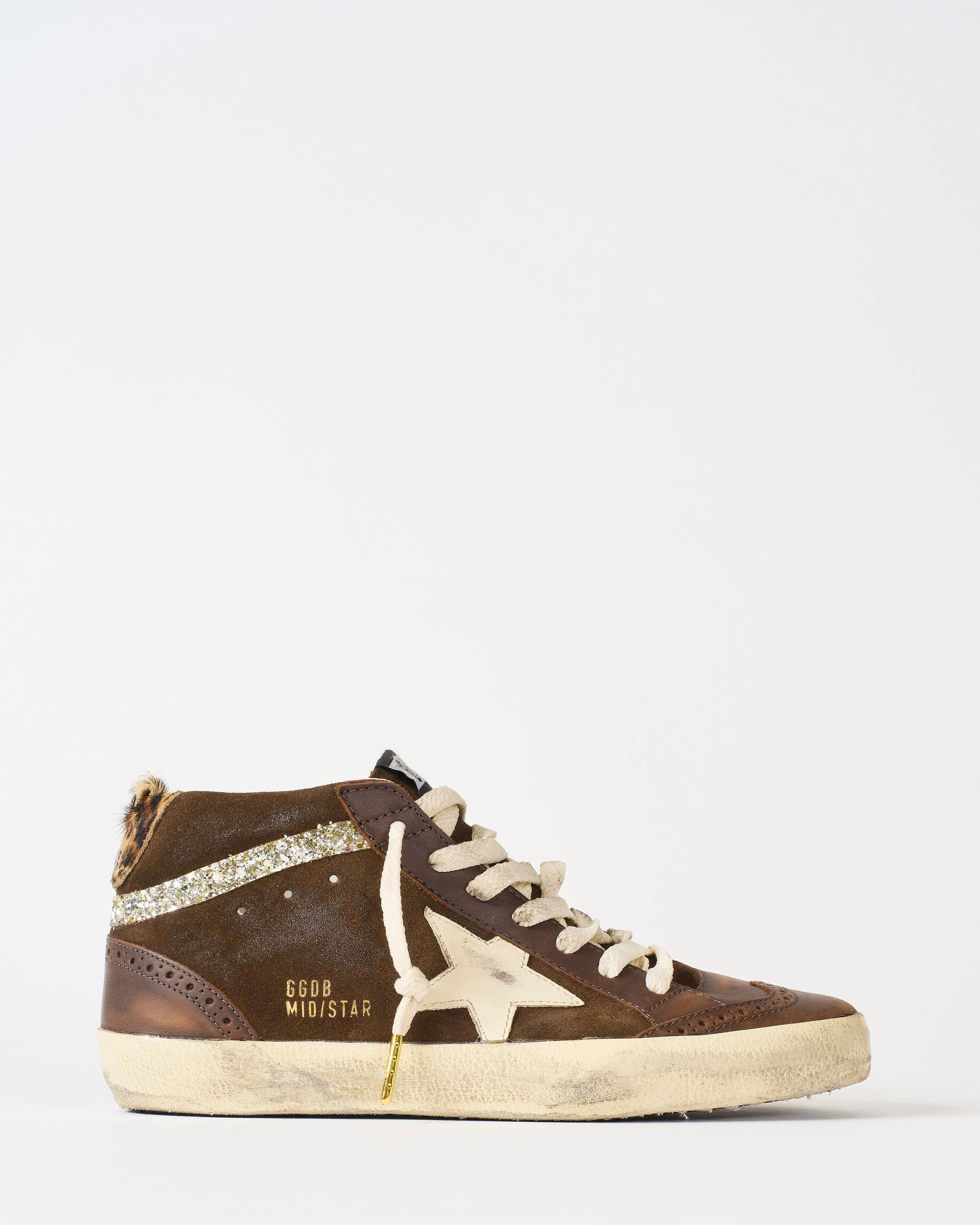 mid star leather toe spur and star suede upper horsy heel